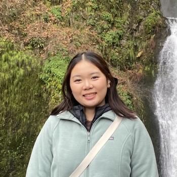 Yucca faces the camera and smiles. 