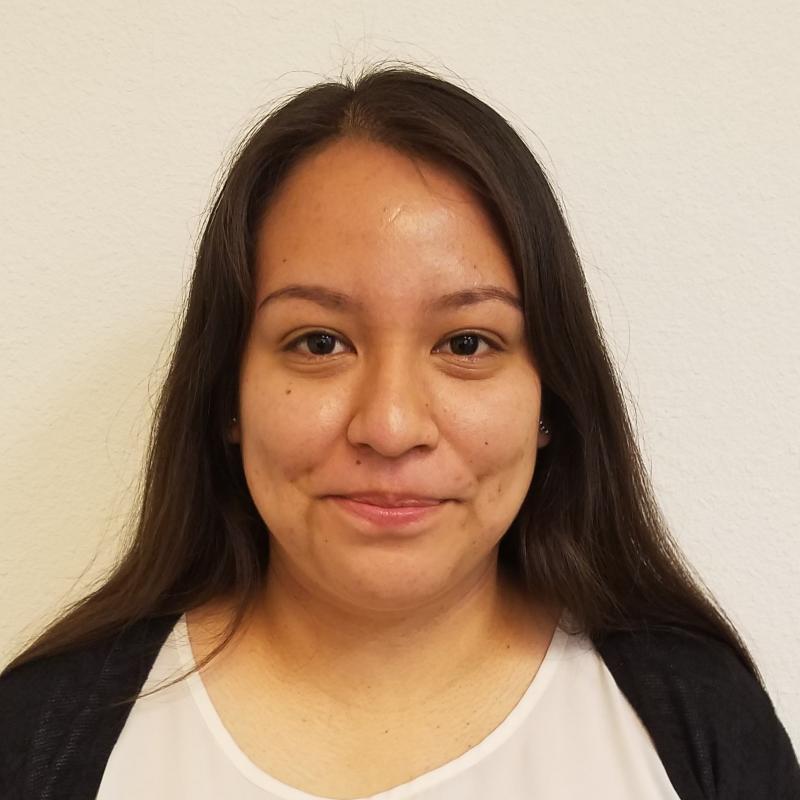 A photo of Xochitl against a white backdrop. 