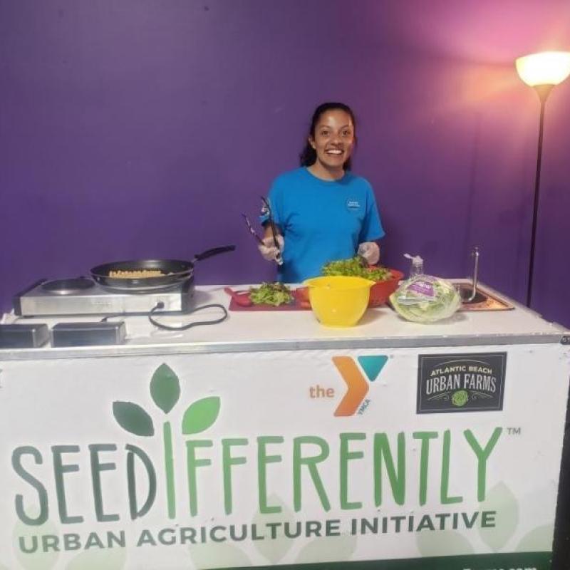 Camille, the First member to serve at the New American Welcome Center!