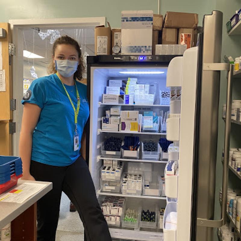 Katie Reilly in front of refrigerated medications