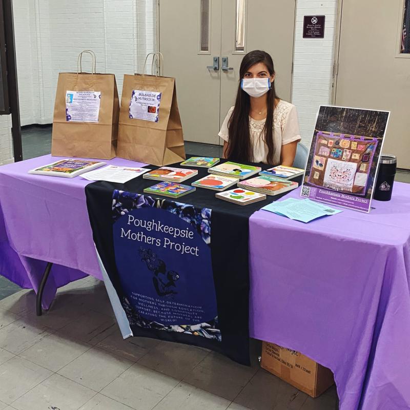 Erin tabling for Poughkeepsie Mothers Project.