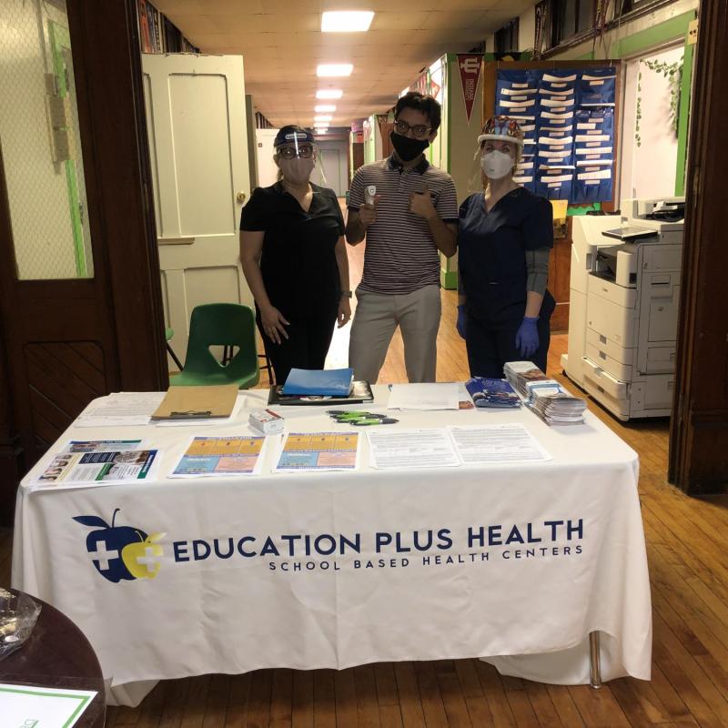 A team prepared for community flu vaccination clinics at Deep Roots Charter School.