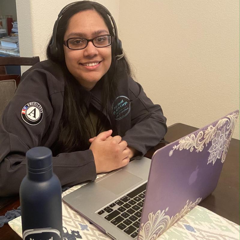 Tahemina Munir in front of her laptop as she serves from home.
