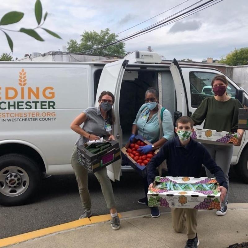 James distributing food for Feeding Westchester.