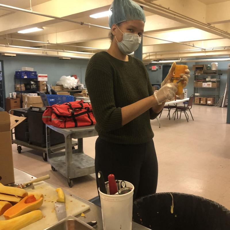 Kathleen helping in preparing meals.
