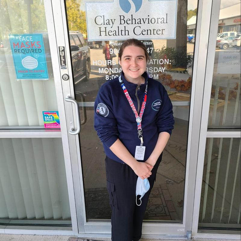 Nate standing at the door to the SUD program office at Clay Behavioral
