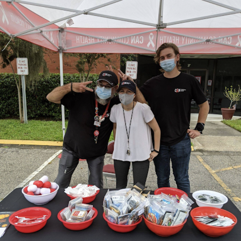 tabling outside of the CAN clinic to hand out condoms and chatting about how to protect your sexual health.