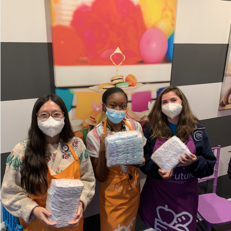 Performing outside service, assisting Safe Future Foundation with wrapping diapers for a diaper drive.