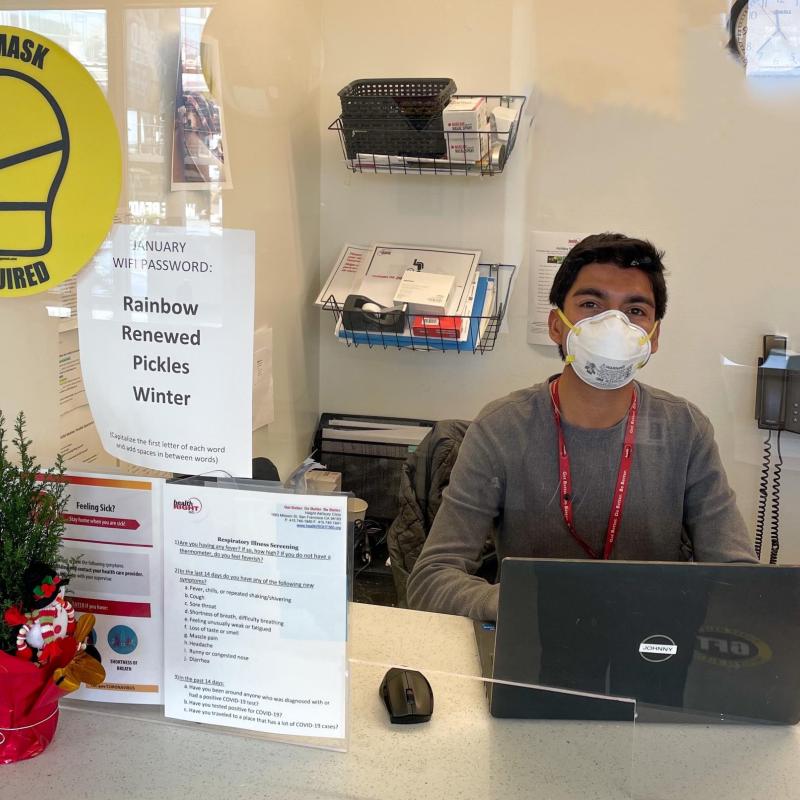 Johnny is seen behind his service station at HealthRIGHT 360, waiting to assist patients that walk into the clinic for services.