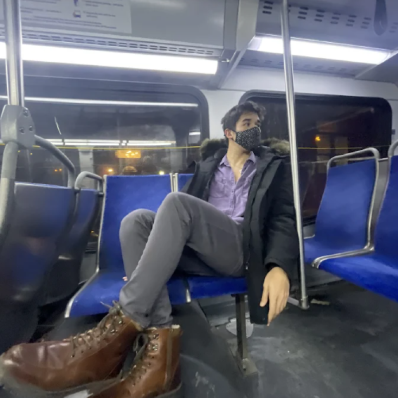 Nathan sitting on a bus