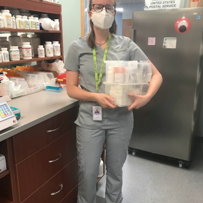 Camille sorting through patient medications at the Sulzbacher pharmacy.