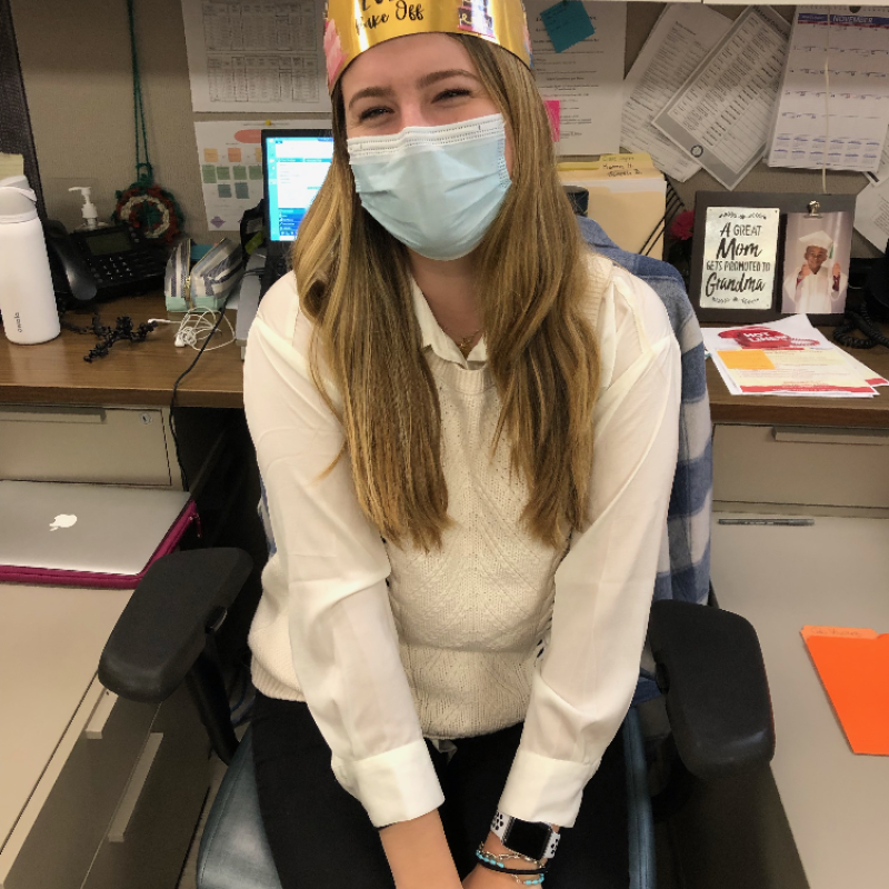 claire wearing a paper crown