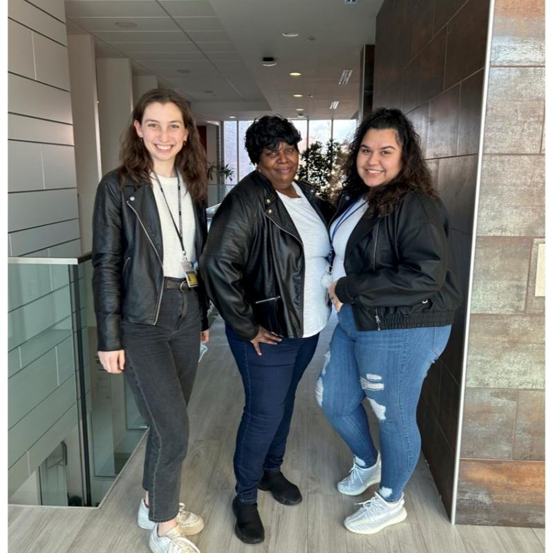 a photo of three people wearing matching leather jackets