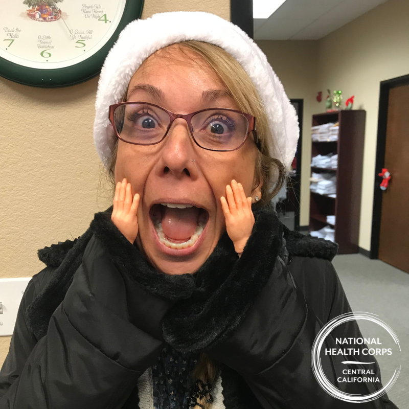 Diana Kantola with a surprised face and tiny hand accessories