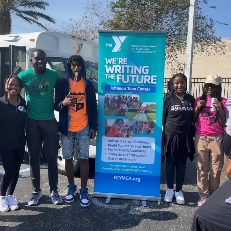 Eliza Leslie is pictured with teens from the Johnson YMCA program
