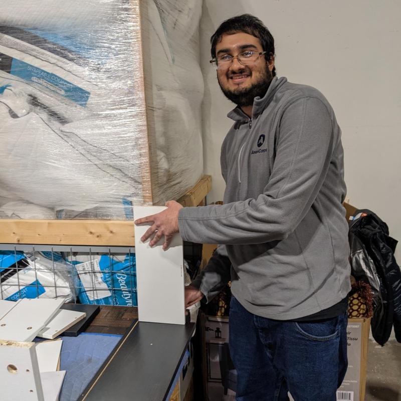 Pragosh is assembling furniture.