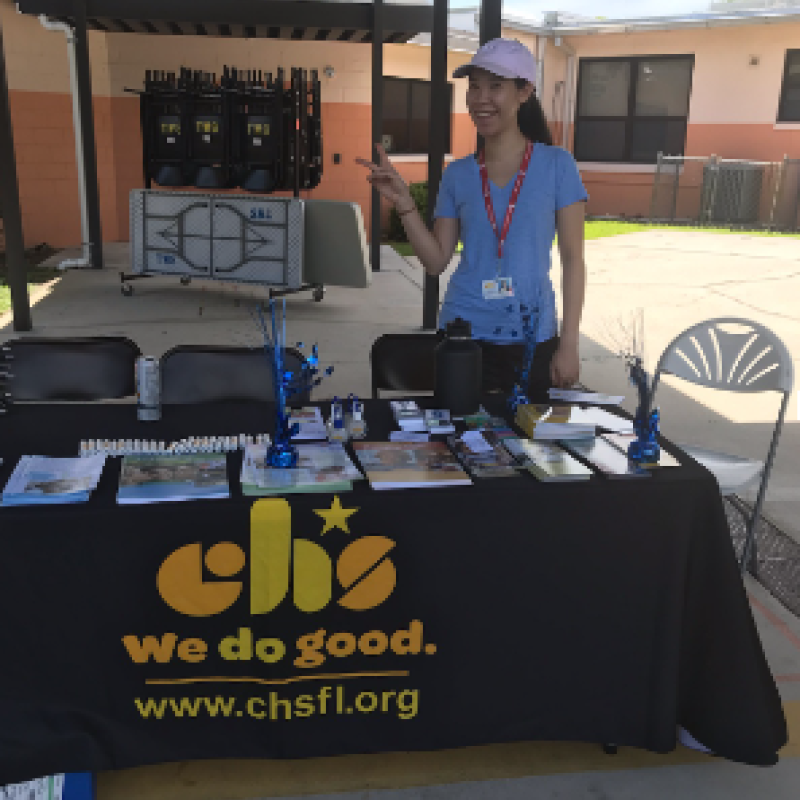 Pictured is Alison Chin tabling at an event for the Childrens' Home Society 