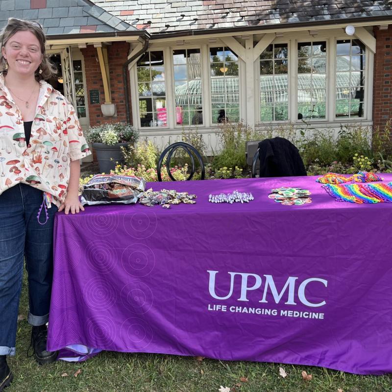 AmeriCorps Member Freya Rolfs of NHC Pittsburgh at a UPMC tabling event.