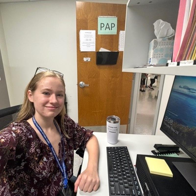 Maddie sitting at desk