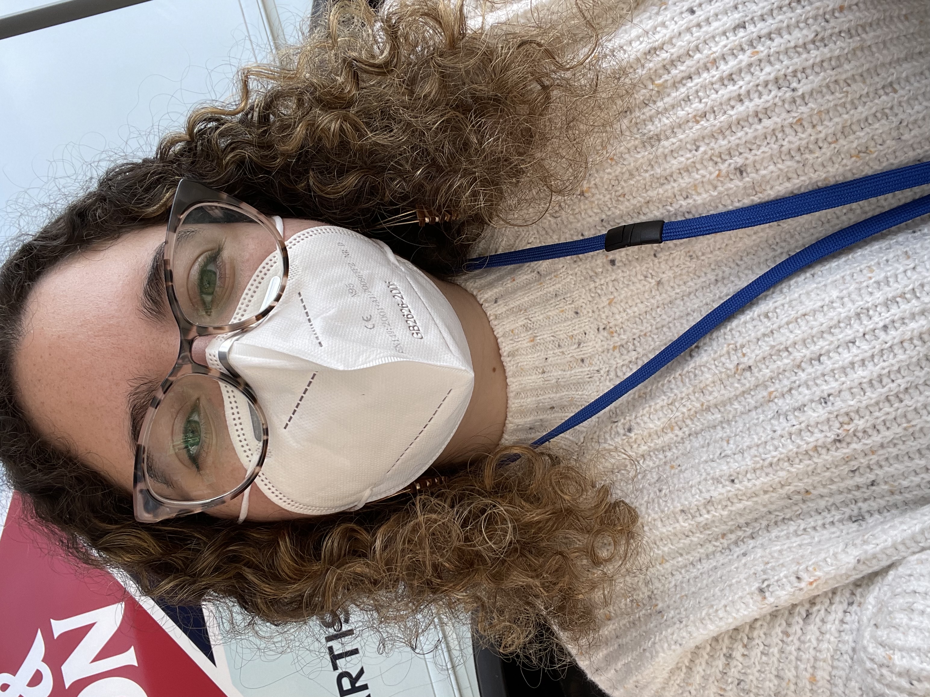 A selfie of Emily standing in front of the mammo van