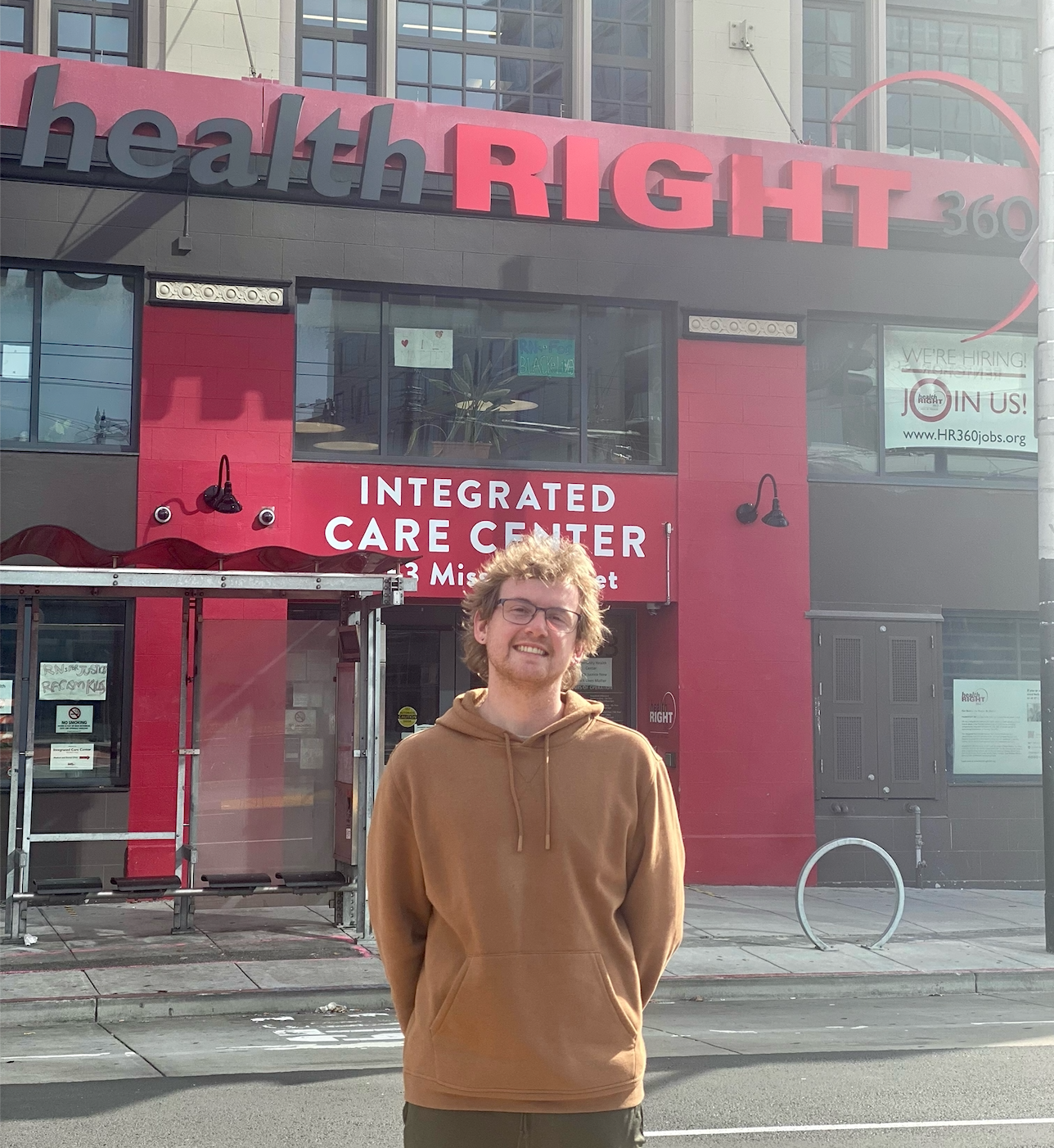Will Crews stands in front of HealthRIGHT 360's front entrance.